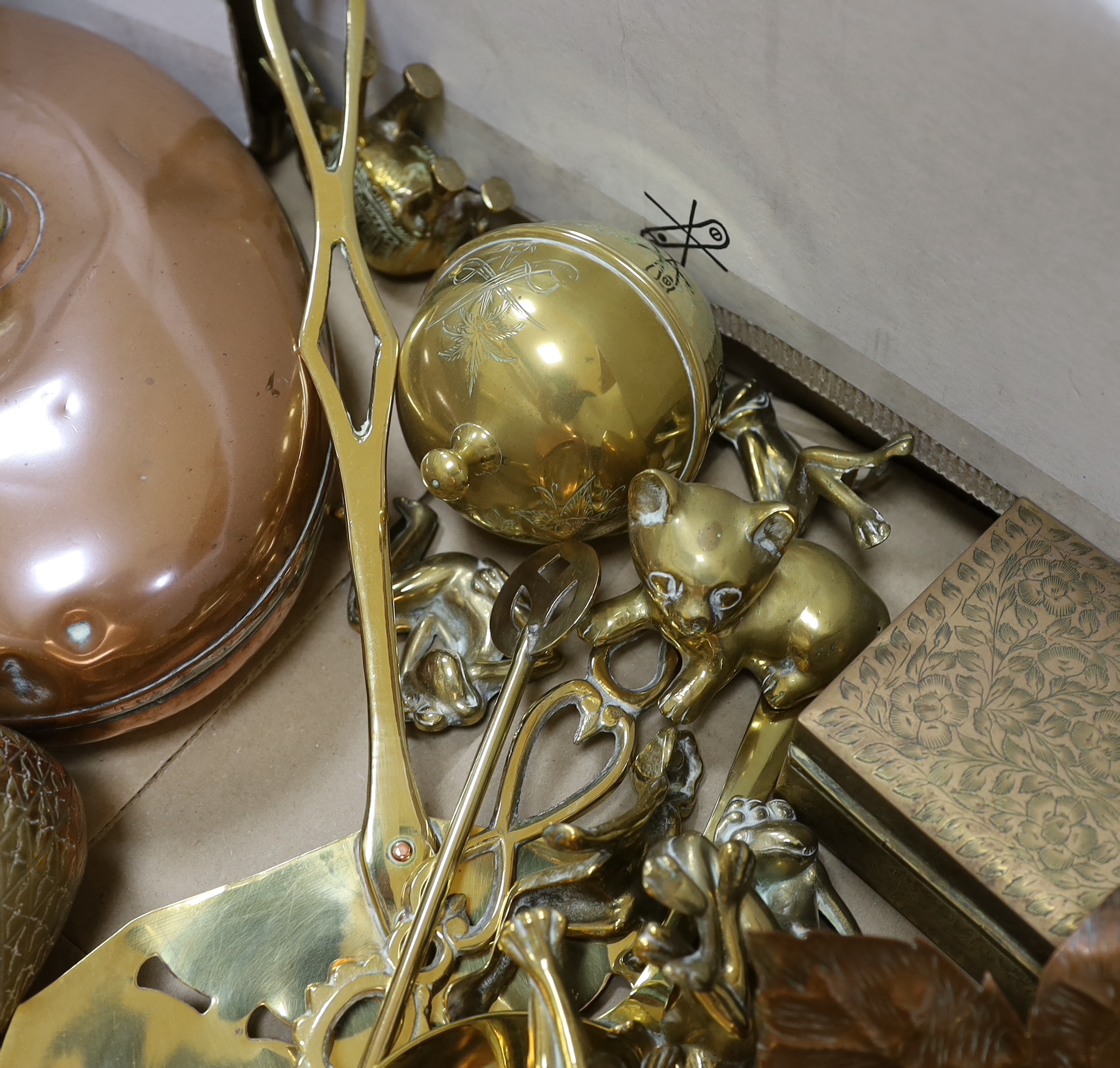 A group of mixed copper and brass including a warming pan, kettle, pot etc